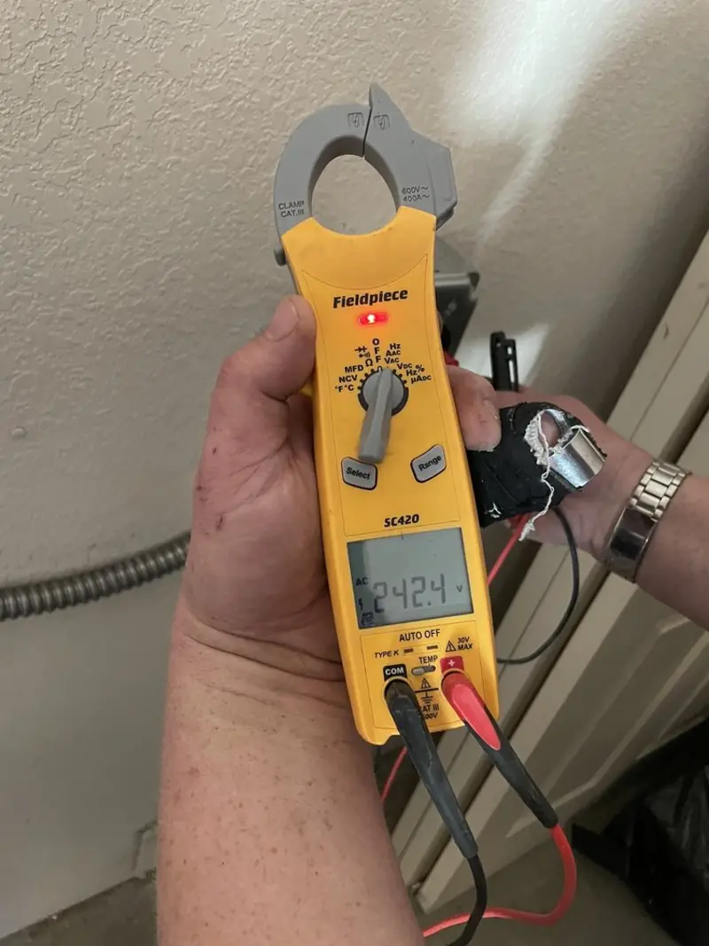 Voltage testing with clamp meter during Electrical Installation Services in Mascot